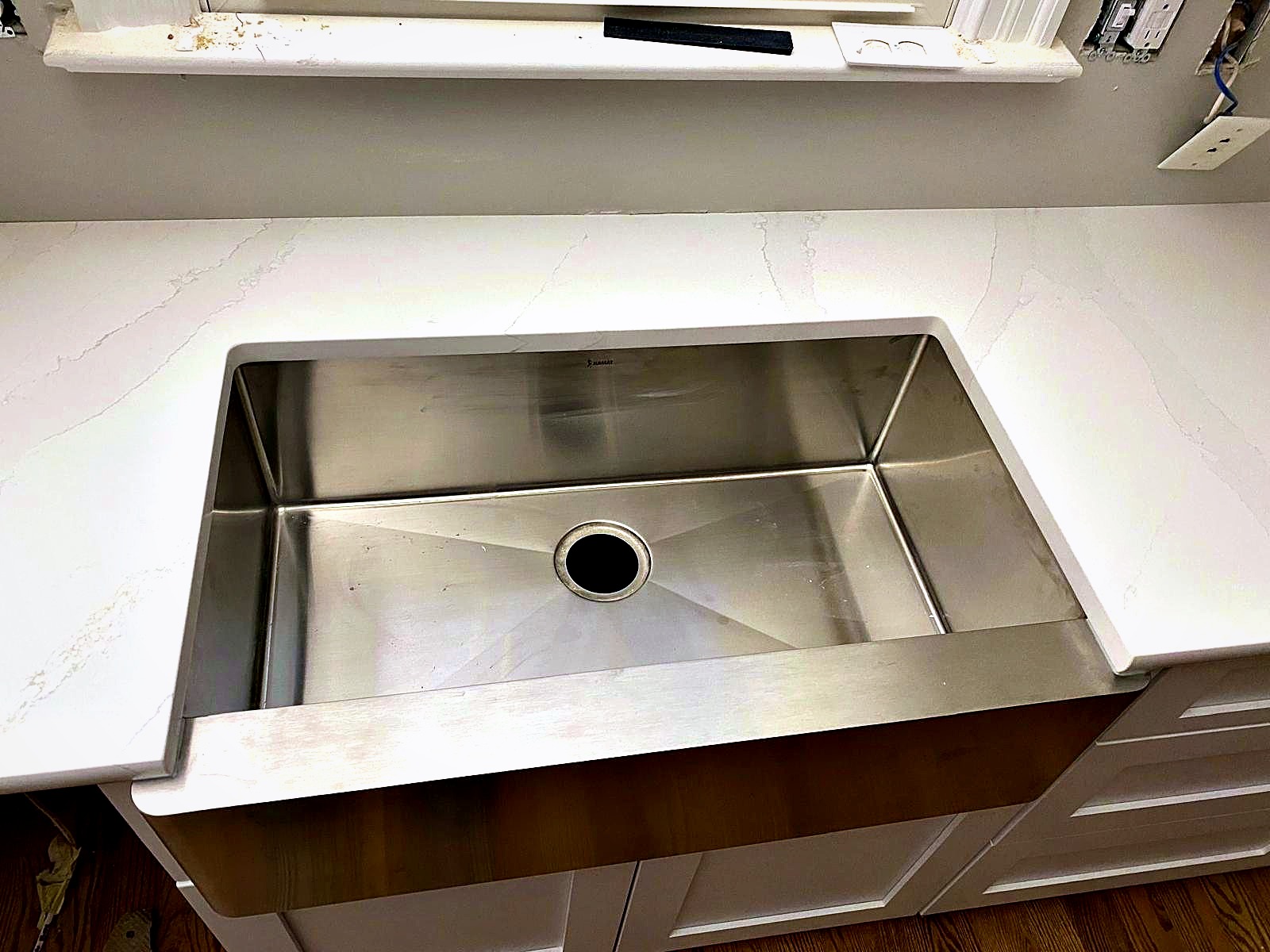 Undermount stainless sink seamed into a quartz countertop by Stone Forever