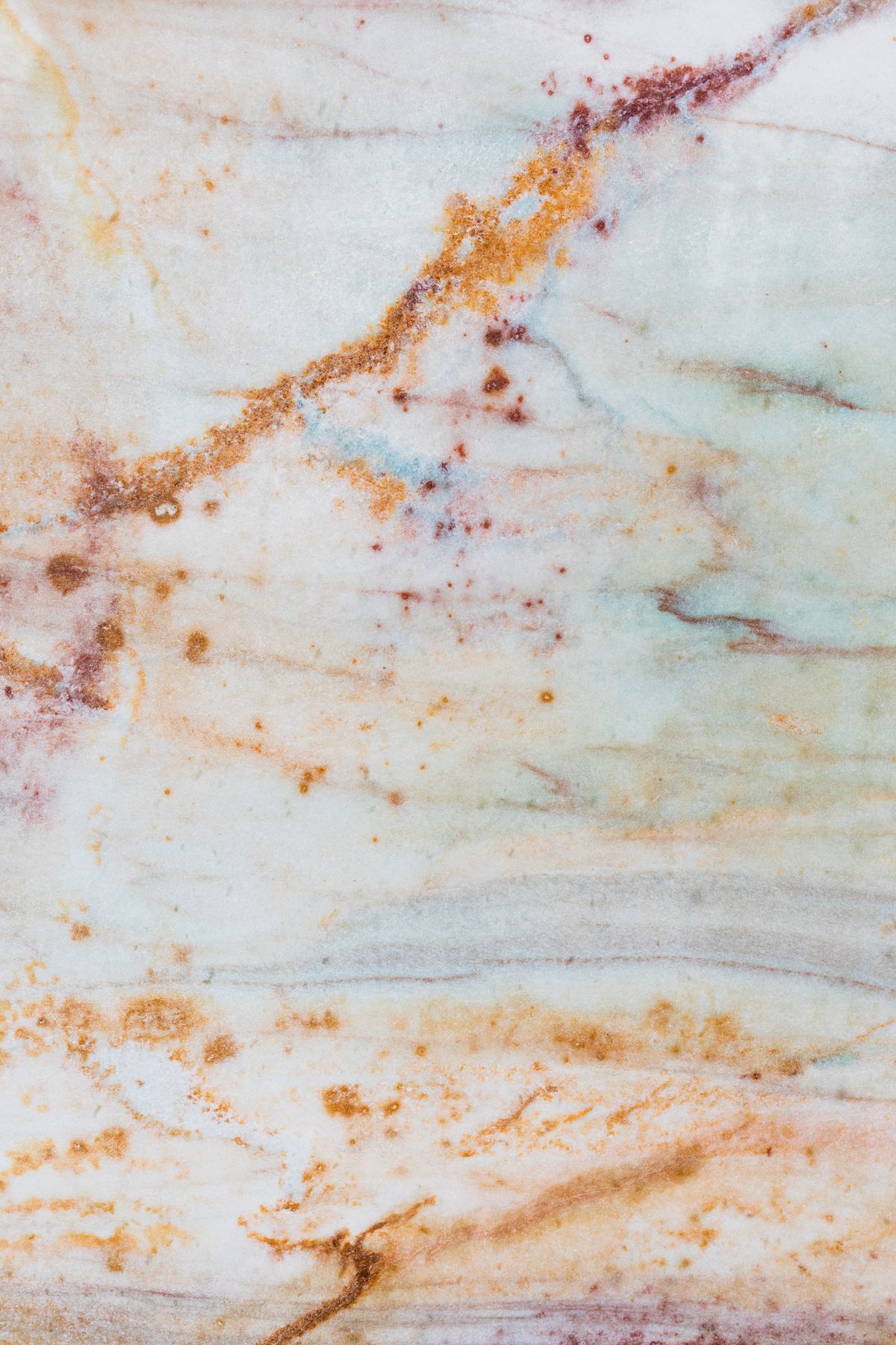 Quartzite slab with bold rust and grey natural veining